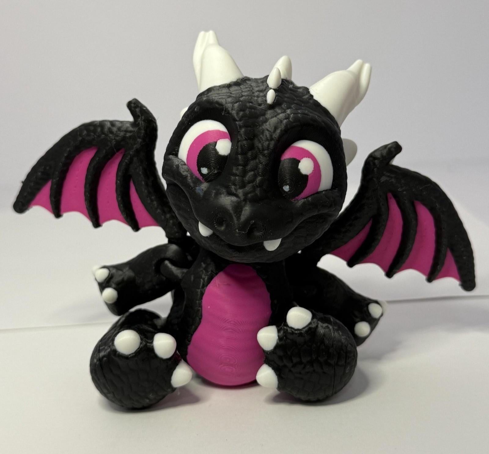 3D Printed Baby Flex Dragon ~ PLA ~ Black and Pink ~ Movable Wings ~ 7 Inch