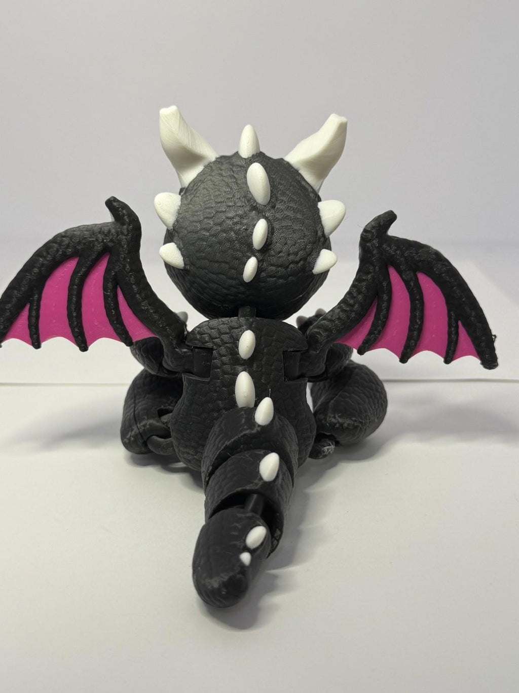 3D Printed Baby Flex Dragon ~ PLA ~ Black and Pink ~ Movable Wings ~ 7 Inch